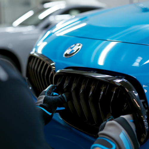 BMW Trained Technician fixes the kidney grille on a BMW vehicle in a BMW Certified Collision Repair Center.